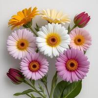 A bouquet of colorful flowers on a white surface photo
