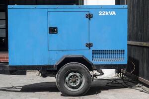 A generator with 22k VA power is used as a backup power supply when a blackout or power outage occurs. photo