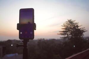 The smartphone used to record in time-lapse mode and capture the early morning scene. photo