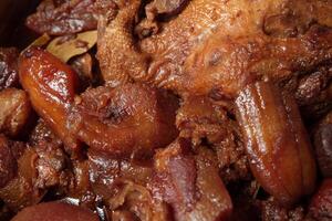 a close up of a cooked chicken and some other food photo