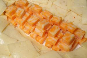 a close up of a cheese and cracker dish photo