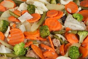 a pan full of vegetables and meat photo