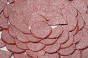 sliced sausages are arranged in a circle photo
