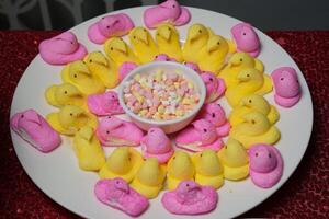 a plate of peeps on a red tablecloth photo