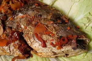 a fish with a lot of spices on it photo