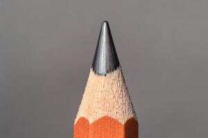 Macro Shot of a Sharp Pencil Tip with Wood Grain Texture photo