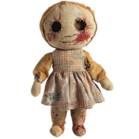Creepy doll with black button eyes and blood stains isolated png