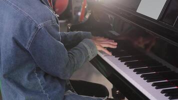 An Individual Engaged in Playing the Piano Within a Beautiful and Artistic Environment. Clip video