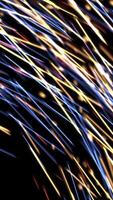 Abstract flow of lines and dots. Animation. Beautiful colorful motion of short bright dashes and tiny defocused particles isolated on black background, seamless loop. video
