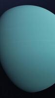 Abstract animation of planet Uranus. Animation. Abstract blue surface of rotating planet Uranus in cosmic stellar space. Beautiful planetary background with planet Uranus video