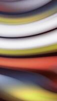 Abstract seamless loop motion of colorful blurred curved stripes. Stock animation. Twisted gradient lines flowing slowly like bright paint stains. video