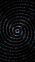 Abstract small triangles moving on a spiral trajectory and flying towards the camera, amazing 3D effect. Animation. Spinning geometric figures on black background. video