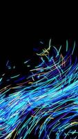 Abstract colorful gentle flow of bended narrow lines over the black background. Animation. Colorful space comet tail moving chaotically. video