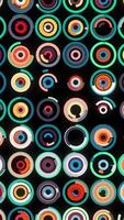 Abstract futuristic background with moving small circles placed in many horizontal parallel rows. Animation. Many moving rings on black background, seamless loop. video
