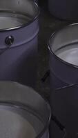 Close up of several buckets of white paint. Media. Industrial background, concept of home renovation. Vertical . video