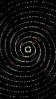 Abstract small triangles moving on a spiral trajectory and flying towards the camera, amazing 3D effect. Animation. Spinning geometric figures on black background. video