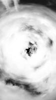 Abstract illustration of cloudy sky. Media. Tunnel of white clouds on a black background. Vertical . video