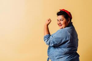 Oversized adult woman looking at camera on an isolated background. photo