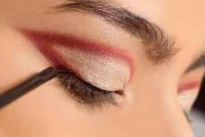 Macro close up of eyeliner brush, make up concept. photo