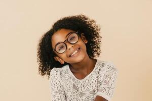 Cheerful smiling child black wearing goggles. photo