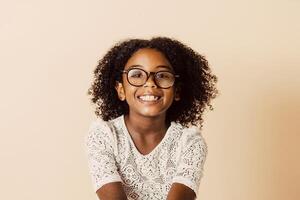 portrait of a smiling girl wearing glasses looking at the camera with copy space. photo