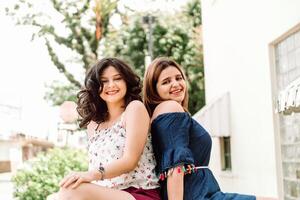portrait of two latinx woman together looking at camera. photo