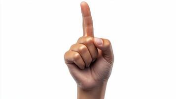 A hand pointing forward against a plain background during a bright daylight setting photo