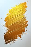 Golden paint stroke on white canvas showcasing creativity and artistic expression photo