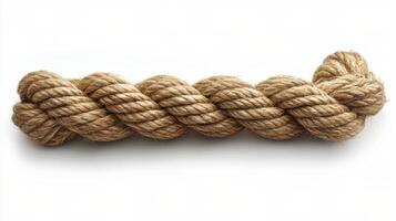 A close-up view of twisted natural fiber rope lying on a plain white background photo