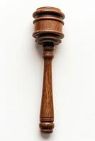 Elegant wooden gavel resting on a smooth white surface suitable for legal proceedings photo