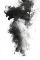 Black powder explosion creating a dramatic burst effect against a white background photo