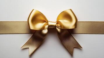 Elegant golden bow on a smooth surface, perfect for gift wrapping or decoration purposes photo