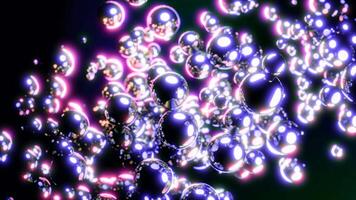 Abstract stream of metallic bubbles on a black background. Design. Flowing glowing spheres. video