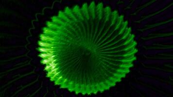 Abstract round spinning shape with blades isolated on a black background. Motion. Rotating complex figure looking like a digital flower. video