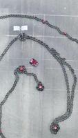 Aerial view of the karting track with moving small red karts, race and motorsport concept. Media. Top view of curves on karting race track. video