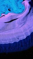 Beautiful pattern of mixed colors on surface. Stock footage. Bright colorful background of mixing colors on liquid surface. Paints create patterns of extraordinary beauty when mixed video