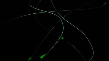 Black background with green and red lines. Design. Small illuminated animation circles move along thin stripes in the animation. video