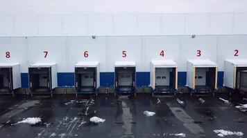 Large garages. Creative. Helicopter view of parking spaces for large trucks with bodies. video
