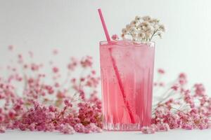 Refreshing pink drinks in elegant glasses with delicate flowers on a light background photo