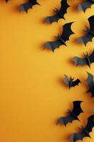 A collection of paper bats flying against a bright orange background during autumn season photo