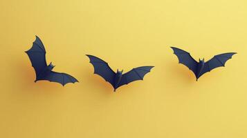 Bats flying against a vibrant yellow backdrop during Halloween-themed decorations photo