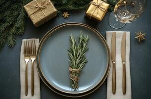Elegant festive table setting with rosemary and sparkling decorations for holiday celebration photo