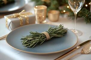 Elegant festive table setting with rosemary and sparkling decorations for holiday celebration photo