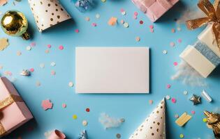 Colorful party decor with blank card on blue background for celebration planning photo