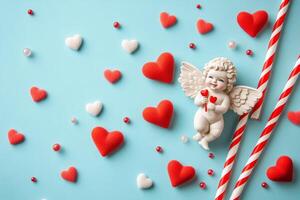 Charming Cupid surrounded by heart-shaped candies on a blue background for Valentines Day photo
