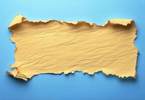 Torn yellow paper against a textured blue background creating a vibrant contrast for design photo