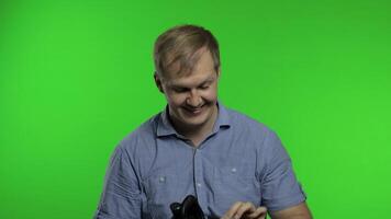 Man using VR headset helmet to play game. Watching virtual reality 3d 360 . Chroma key video