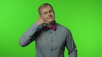 Hello, call me. Man with telephone hand gesture near head and communicate, talk by phone. Chroma key video