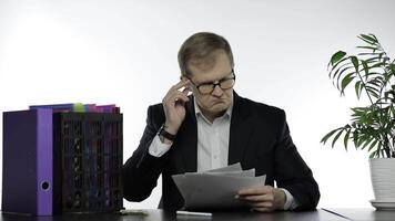Businessman working in office. Analyzing paperwork. Very happy with the result video