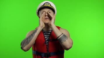 Muscular sailor man works as lifeguard at beach shouts someone, reports danger video